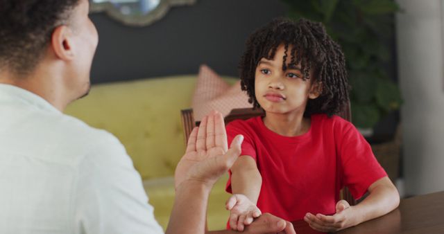 Father and Son Talking While Having Serious Conversation at Home - Download Free Stock Images Pikwizard.com