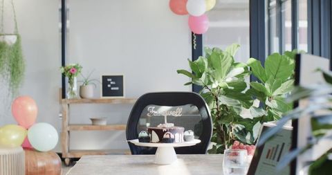 Corporate farewell party office decor with cake and balloons