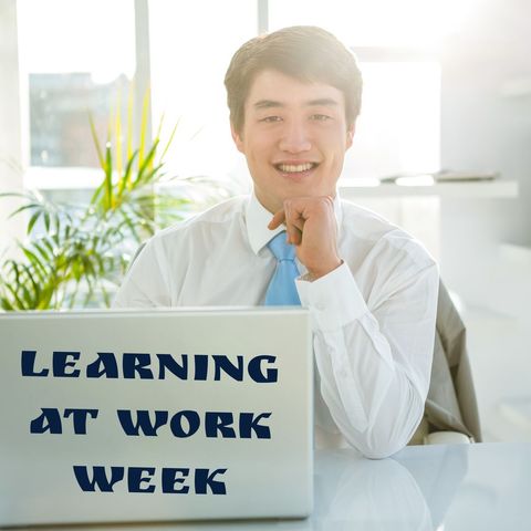 smiling young businessman promoting learning at work - Download Free Stock Templates Pikwizard.com