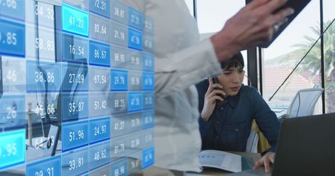 Business Professionals Analyzing Financial Data in Office Setting