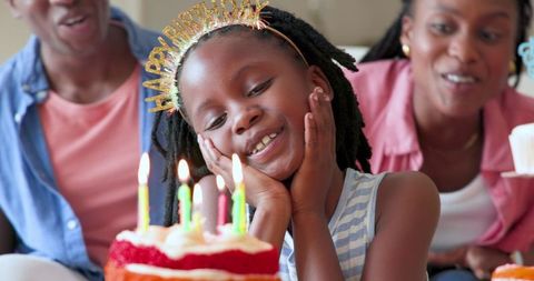 Joyful Family Celebrating Daughter's Birthday with Cake