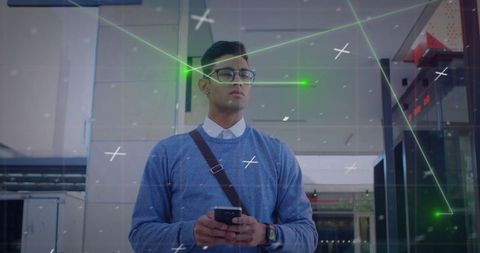 Man in blue sweater using smartphone with ar technology overlay