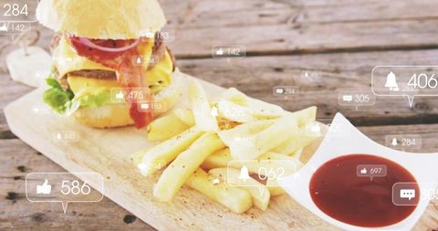 Bacon cheeseburger with crispy fries and ketchup on rustic board with social media overlay