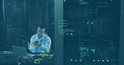 It specialist managing ethernet cables in modern server room