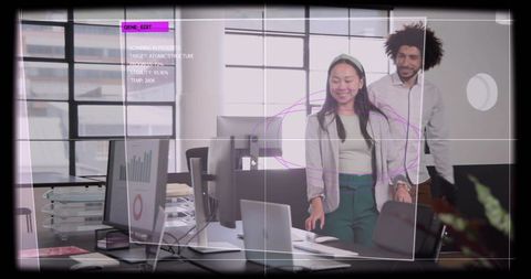 Coworkers collaborating in open-plan office using augmented analytics HUD overlay