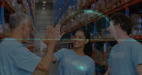 Diverse Volunteers High-Fiving with Data Overlay in Warehouse
