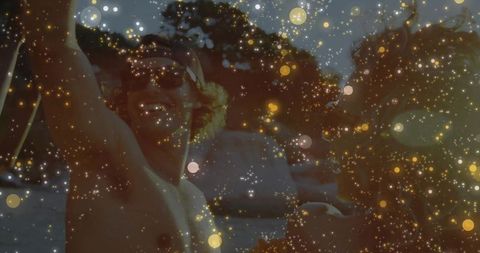 Shirtless man enjoying sunny day on boat with smiling backwards cap