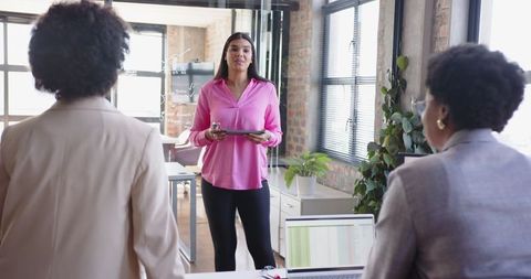 Professional Team Collaborating in Modern Loft-Style Office Space