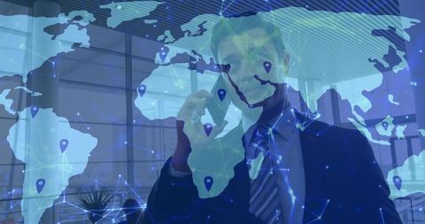 Asian Businessman on Phone Overlaid with Global Connectivity Map