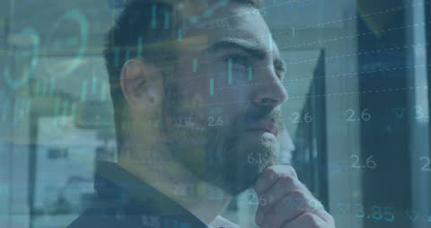 Businessman Analyzing Financial Data with Futuristic Overlay