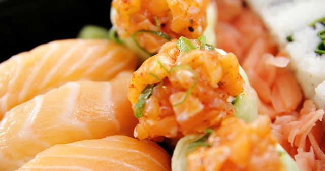 Close-up view highlighting fresh, beautifully prepared salmon nigiri alongside meticulously made spicy salmon rolls, showcasing vibrant colors and appealing presentation. Perfect for use in restaurant menus, Japanese cuisine promotions, food blogs, and culinary articles.