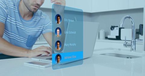 Remote work holographic contacts on laptop at modern kitchen island man typing glossy ui