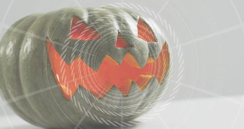 Glowing carved pumpkin lantern emitting warm light with geometric radar rings overlay