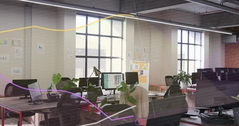 Showcasing modern open-plan office featuring collaborative workstations, greenery and daylight