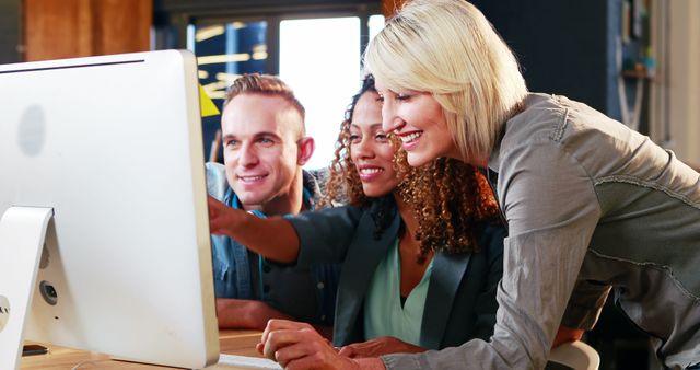 Team of Diverse Colleagues Collaborating at Computer in Work Environment - Download Free Stock Images Pikwizard.com