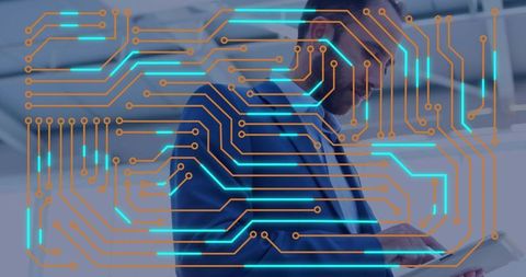 Businessman holding tablet scanning with neon circuit overlay for corporate technology