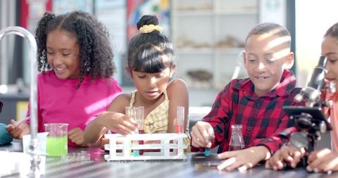 Diverse Group of Students Engaged in Fun Chemistry Experiment