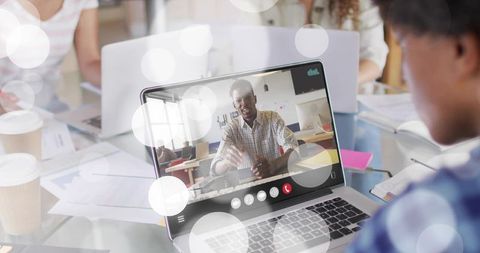 Remote Presenter Leading Team Collaboration via Video Call on Laptop in Office