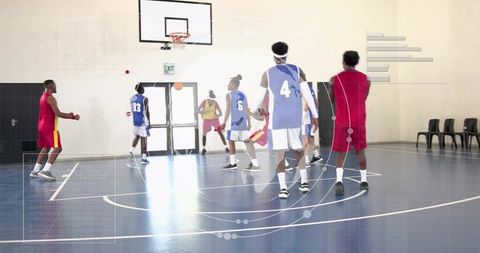 Indoor basketball team practicing on glossy court with futuristic hud performance overlays