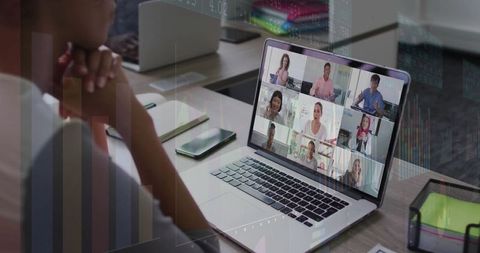 Professional Woman in Virtual Meeting Focused on Collaborative Work