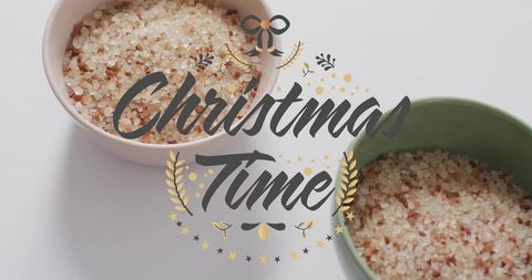 Minimal christmas flatlay with pink himalayan salt in ceramic bowls, festive still life