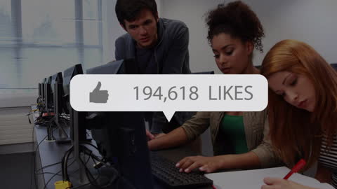 Students Collaborating on Social Media Project in Classroom