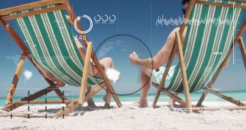 Couple relaxing on tropical beach chairs with futuristic data hud overlay for travel