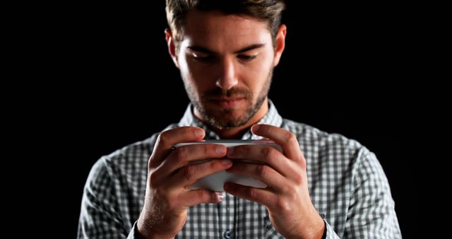 Man Playing Mobile Game in Dark Background - Download Free Stock Images Pikwizard.com