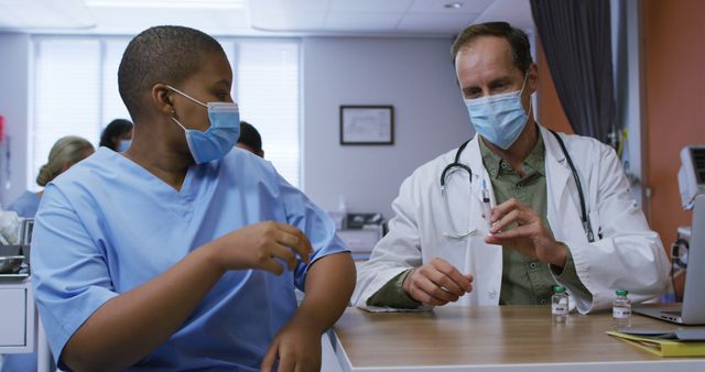 Healthcare Workers Discussing Patient Treatment at Hospital - Download Free Stock Images Pikwizard.com