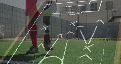 Soccer Player with Prosthetic Leg and Game Tactics Strategy Overlay