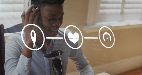 African American Businesswoman Engaged in Virtual Meeting with Data Icons Overlay