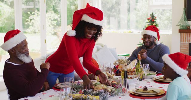 Happy African American family celebrating Christmas dinner together - Download Free Stock Images Pikwizard.com