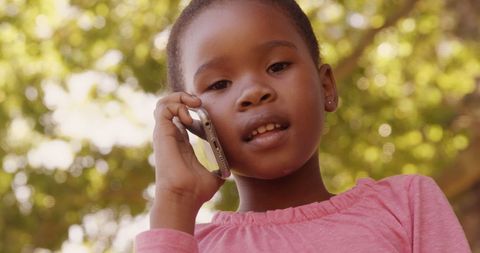 Cute Girl in Park Making Phone Call with Mobile Phone - Download Free Stock Images Pikwizard.com