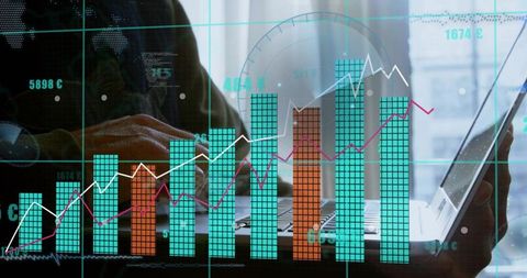 Businesswoman Using Laptop and Tablet with Financial Charts and Data Dashboards