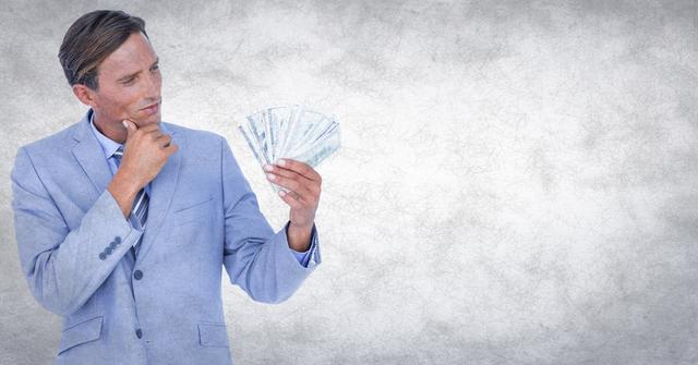 Man holding money in contemplative pose, perfect for finance-related materials, business success concepts, and economic strategies advertisement or article.