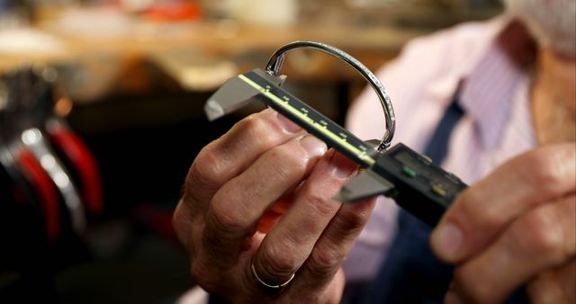 Watchmaker Measuring Timepiece with Caliper in Workshop - Download Free Stock Images Pikwizard.com