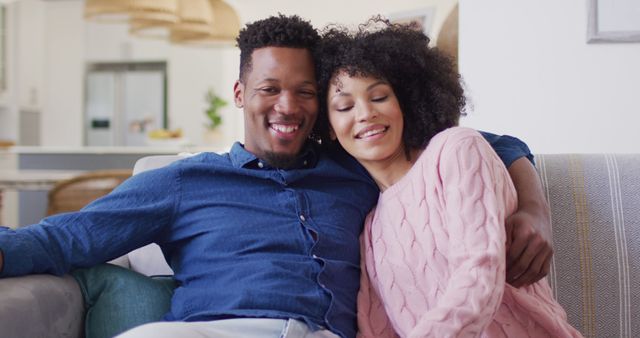 Happy african american couple embracing together in living room - Download Free Stock Photos Pikwizard.com