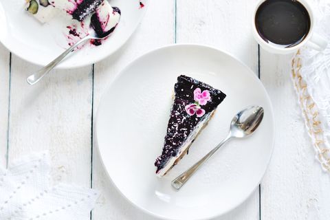 Blueberry Cheesecake Sliced on Elegant White Plates with Coffee