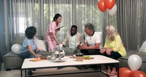 Multiracial Group Celebrating New Physiotherapy Patient Arrival