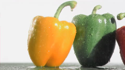 Colorful Bell Peppers in Slow Motion Rainfall