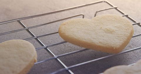 Heart-Shaped Biscuit Cooling on Wire Rack in Natural Light - Download Free Stock Images Pikwizard.com