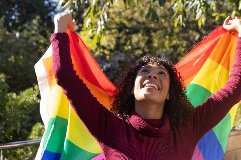 Woman Celebrating LGBTQ Pride in Vibrant Park Setting
