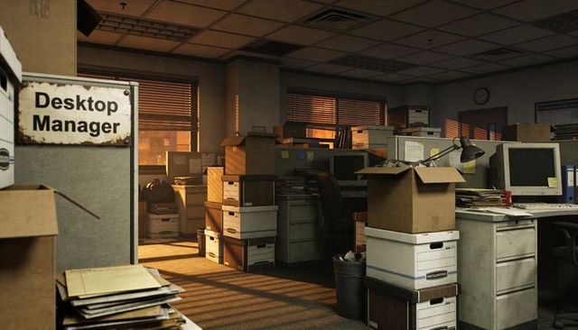 Cluttered cubicle office bathing in warm sunset light with stacked archive boxes