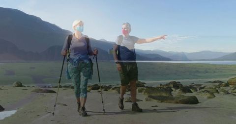 Senior Couple Hiking Along Scenic Coastal Trail with Trekking Gear