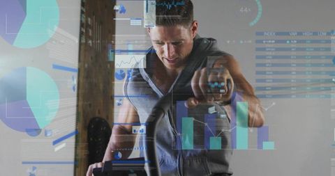 Muscular man pedaling intense indoor cycling workout with performance analytics overlay