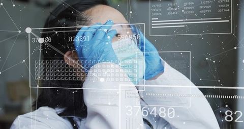Scientist Adjusting Mask with Digital Data Overlays in Laboratory