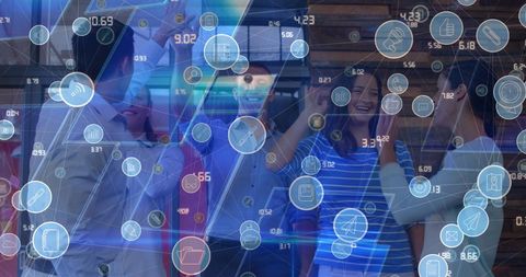 Team celebrating success amidst digital technologies