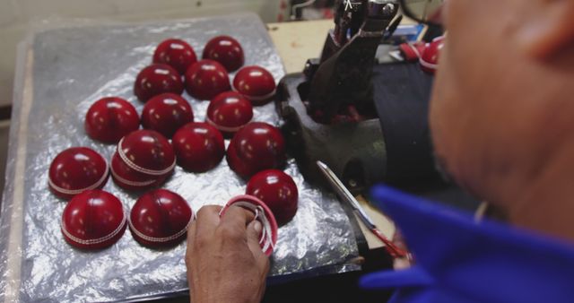 Craftsman Hand-stitching Red Leather Cricket Balls in Workshop - Download Free Stock Images Pikwizard.com