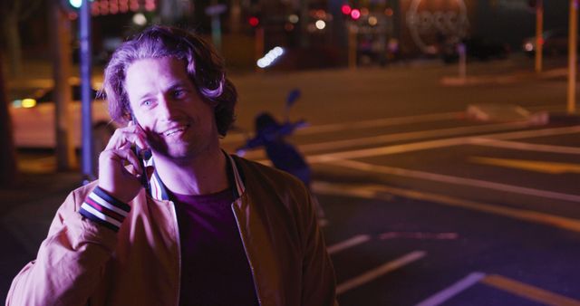 Man Speaking on Phone at Night in Urban Street - Download Free Stock Images Pikwizard.com