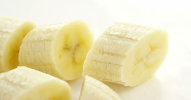 Close-up of Freshly Sliced Bananas on White Background - Download Free Stock Images Pikwizard.com